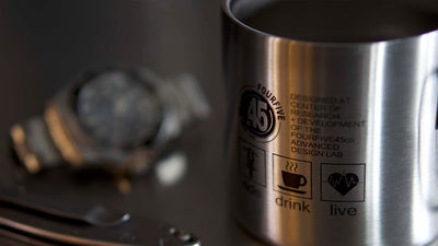 FOURFIVE 45 STAINLESS STEEL DOUBLE WALLED COFFEE MUG CLOSE UP SITTING ON TABLE
