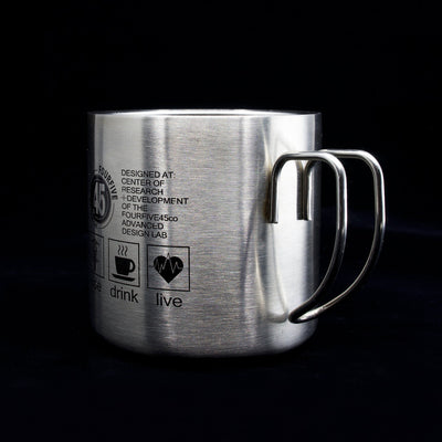 A Fourfive 45 ACP coffee mug in double walled stainless steel construction with graphics on its body facing 45 degrees to the left in black background.